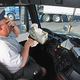 Columbus, OH trucker Rodney Schrag listens to Hardin's song on his truck's radio.